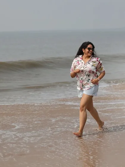 Capturing the fun and spontaneous moments is key to our candid style. Here, a couple playfully runs along the shoreline, resulting in a natural photograph filled with laughter and movement.