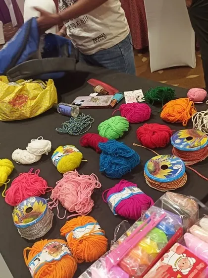 A look at some of the craft supplies I provide, including various colors of yarn and string for friendship bracelets or other DIY projects.