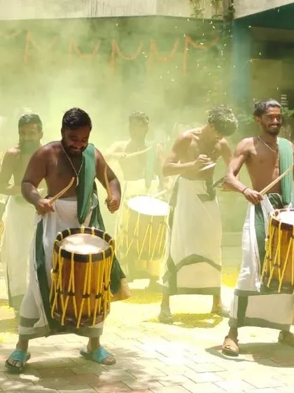 Playing through a cloud of festive yellow smoke, creating a visually stunning and energetic atmosphere.