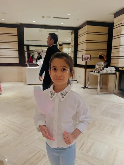 A little guest looking sweet with her heart-shaped cotton candy. We can create fun shapes to match your party's theme.