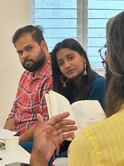 A candid moment of intense discussion and shared learning during the literature gathering.