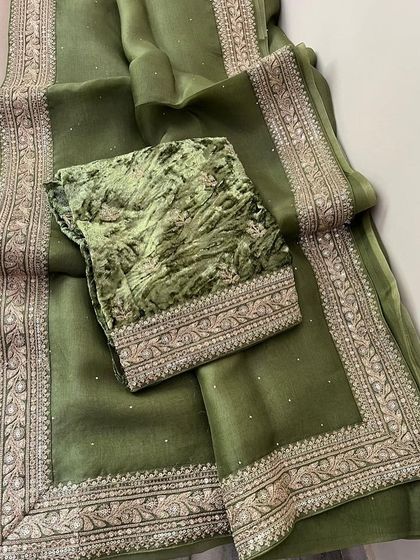 A look at my Sabyasachi-inspired collection. These sets feature pure organza sarees with detailed borders, paired with luxurious velvet designer blouses. They are available in a range of beautiful colors like brown, navy, green, black, yellow, purple, and off-white.