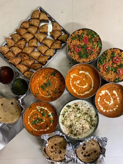 Another view of the elaborate Jain lunch spread for a farmhouse get-together.