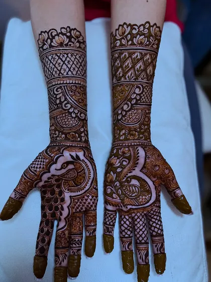 If you can dream it, I can design it. This client wanted a majestic peacock design, and I created this intricate pattern that flows beautifully from the palm to the forearm.