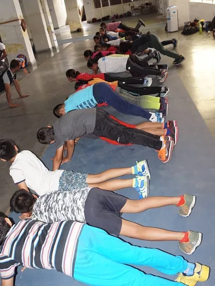 Strength and conditioning are non negotiable. Our fencers build core strength and endurance through exercises like planks, which are essential for maintaining stability and power during long matches.