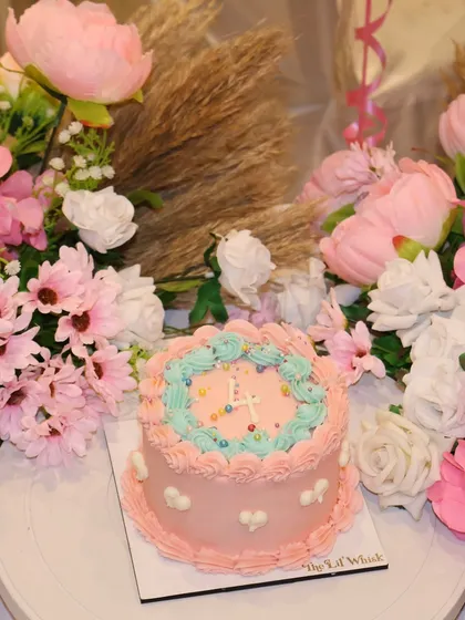 Celebrating four sweet years of our bakery. This pastel pink and blue cake with vintage piping was the centerpiece of our anniversary workshop celebration.