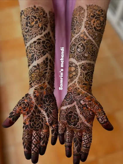 A unique designer pattern with a mix of floral and geometric elements. The use of negative space in a vine-like pattern on the arms is very striking.