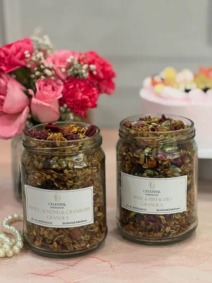 We believe in mindful indulgence, like our handmade granola. Pictured here are two of our favorite varieties, Honey Almond & Cranberry and Rose & Pistachio, both packed with fiber, healthy fats, and protein, and made without any refined sugar.