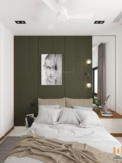 A view of the bed with its simple headboard and a full-height mirror on the side table, a trick to make the room feel larger.