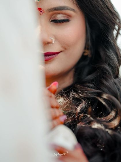 An artistic close-up of the bride, her face partially obscured, creating a soft and intimate portrait.