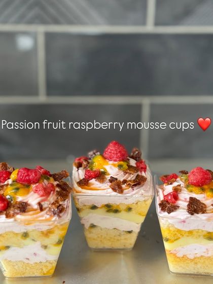 Our vibrant Passion Fruit Raspberry mousse cups. The tart fruit flavors are balanced with a sweet vanilla sponge and creamy mousse.