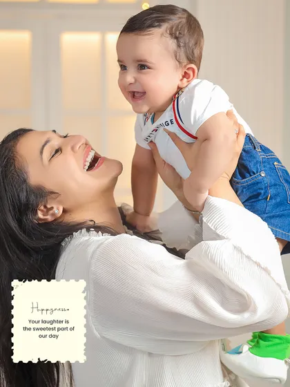 Unscripted laughter is one of my favorite things to photograph. This candid shot of a mother and her son is all about capturing authentic joy, showing the beautiful, energetic connection that makes each family unique.