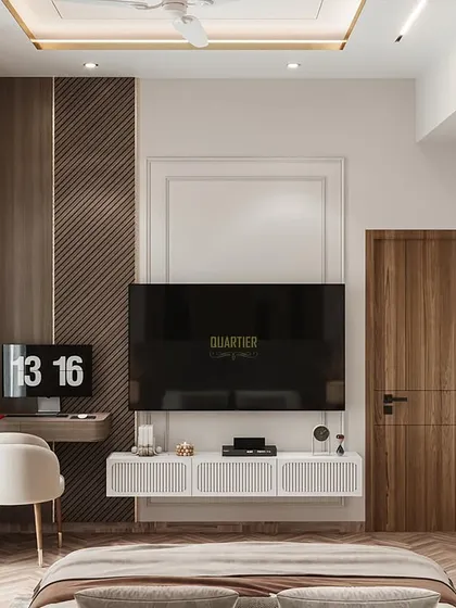 The TV and workstation view of the Apex D'Rio master bedroom render. The design cleverly flushes the door into the paneling, maintaining a seamless look. The use of wood and gold accents adds warmth and luxury.