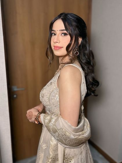 A side profile of this fresh and pretty morning engagement makeup. The soft curls and minimal jewelry complete the look perfectly.