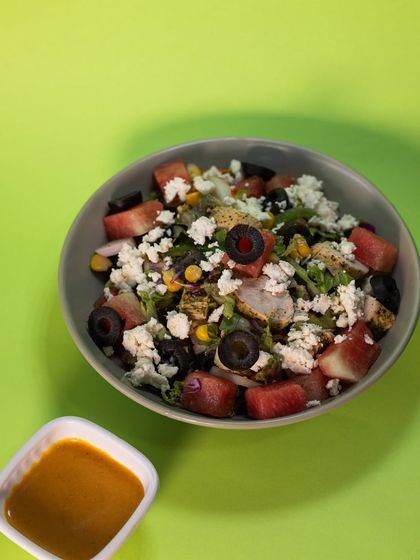 Our refreshing Watermelon Feta Chicken Salad, served with a side of our special mango-chipotle dip. It's the perfect mix of sweet, savory, and tangy.