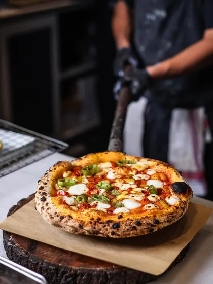 A pizza fresh from the oven is the perfect centerpiece for any celebration, especially during the festive winter season.