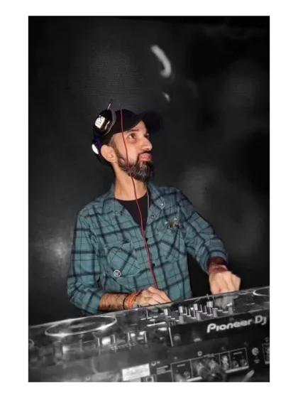 A moody, black and white shot of me at the console, focused on the music and the crowd in front of me.
