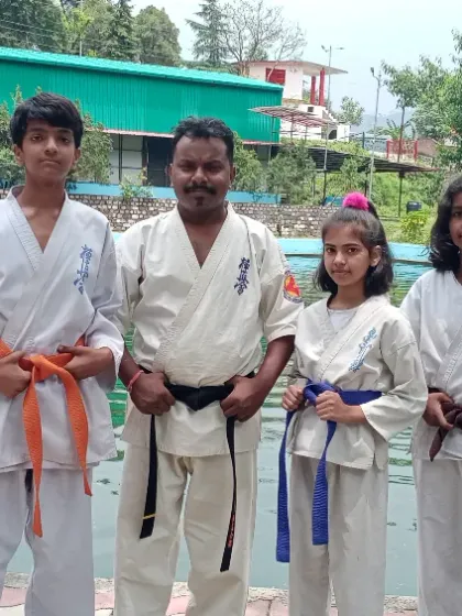 A group photo with my students by the lakeside. Each student, from blue belt to brown belt, has shown great progress during the camp.