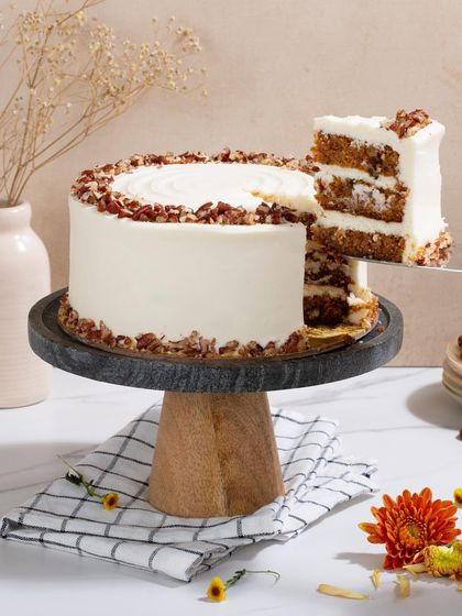 A classic for a reason. My carrot and walnut cake is incredibly moist and flavorful, covered in a generous layer of smooth cream cheese frosting and toasted pecans.