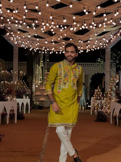 A candid shot in a green kurta under beautiful lighting. I always try to bring my own style and a bit of humor to every event.