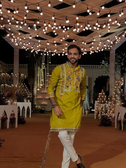 A candid shot in a green kurta under beautiful lighting. I always try to bring my own style and a bit of humor to every event.
