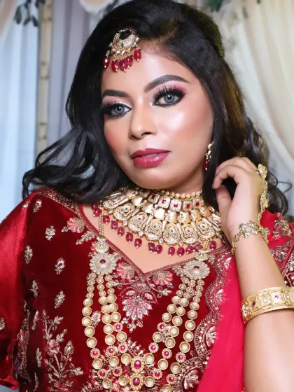 A beautiful close-up of the bride, highlighting the flawless HD makeup base and the dramatic eye look. The grey contact lenses add an extra touch of glamour.