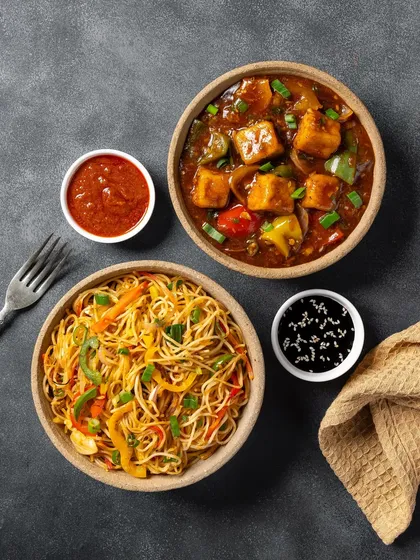 A pairing of chili paneer and vegetable hakka noodles, another popular Indo-Chinese combo from Chhappan Bhog.