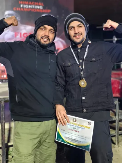Another champion from my team, showing off his medal and certificate. Hard work pays off.
