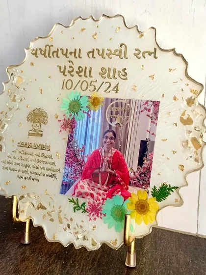 A memorial frame with a photo, mantra, and preserved flowers. A beautiful way to honor a loved one.