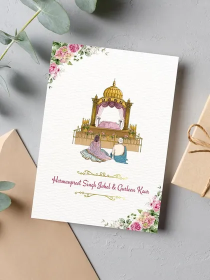 A serene and classic invitation for a Punjabi Anand Karaj ceremony. The design features a custom illustration of the couple at the Gurudwara, framed by soft pink watercolor florals for a touch of timeless elegance.