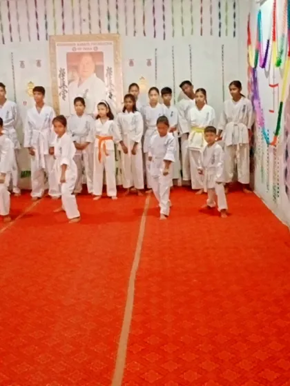 A wide view of the students lined up for their belt test in the dojo.