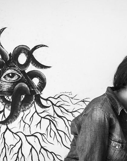 A moment of pure laughter next to a piece of art. This 'Ignite' portrait captures the subject's vibrant personality.