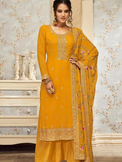 This mustard salwar kameez is like a ray of sunshine. The heavy thread embroidery and floral dupatta make it a cheerful and bright choice for any celebration.