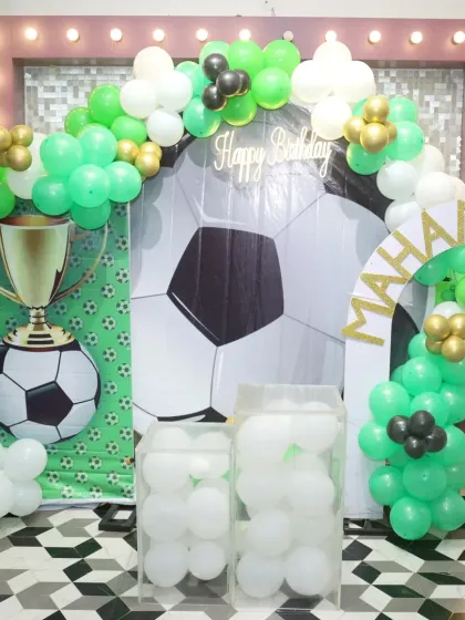 Goal! This football-themed party was a huge win. We set up a field backdrop, a giant soccer ball, and a trophy display for the little champion.