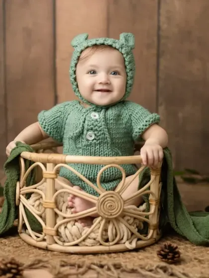 A full view of the woodland bear setup, with a rustic wooden background and green leafy accents.