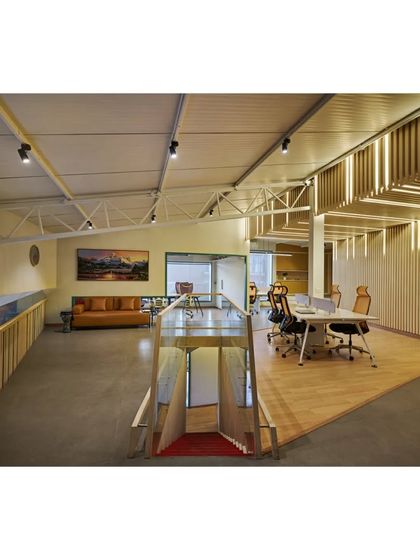 The interior of the Kadence Office, designed for a music company. The space is defined by striped, acoustically treated surfaces derived from graphic abstractions of soundwaves. The design creates different zones for creative work, meetings, and performances.