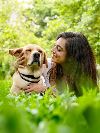 A tender moment between me and my own dog, Prancer. This photo captures the quiet, deep connection that inspired my journey as a pet photographer.