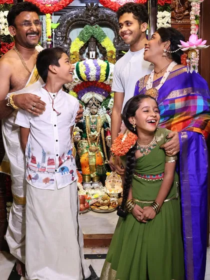 Festivals are a time for family. Here we are, sharing a joyful moment during our Varamahalakshmi celebrations. I believe in involving the entire family to create lasting memories and pass on our traditions.