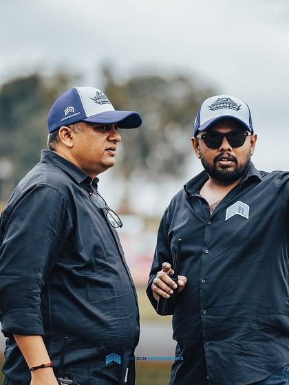 Two of the event organizers discussing logistics at the track. It takes a massive effort from many people to bring these events to life.