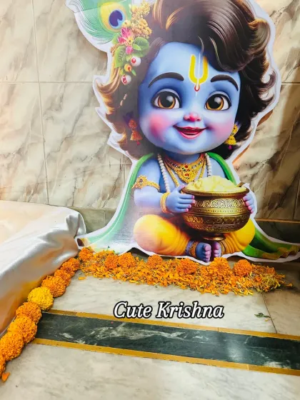A close-up of the cute Krishna cutout used in the decor. These little props add so much charm and are always a hit with guests and for photos.