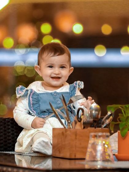 A stunning portrait with beautiful background bokeh. This shot highlights the birthday girl's happy smile in a more artistic style.