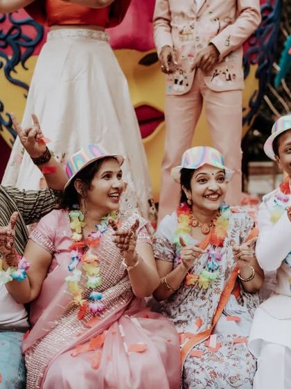 The family having a great time at the carnival party, posing with fun props.