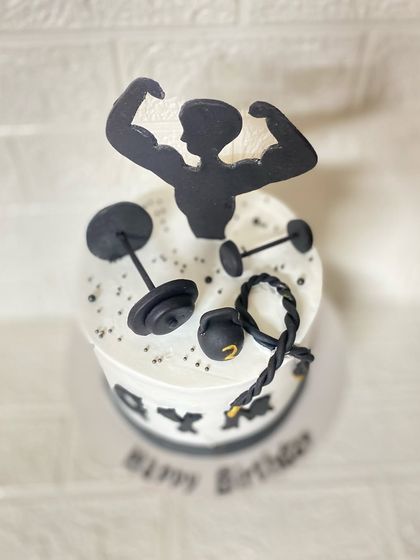 A top-down view of the gym cake, showing all the workout essentials.