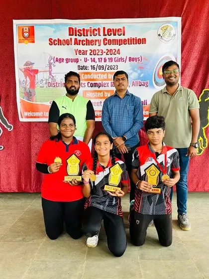 Our three gold medal winners from the Raigad school district competition, posing with their coaches and their well-deserved awards.