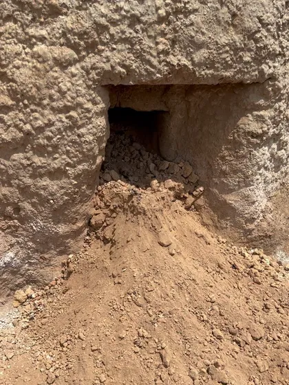 The opening at the base of the lime kiln from which the finished quicklime is extracted after firing. Witnessing this traditional process firsthand deepens our respect for the materials we work with.