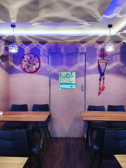 The mood in the evening with our special lighting. The patterns on the wall and the hanging decor create a unique and cozy ambiance for your dinner.