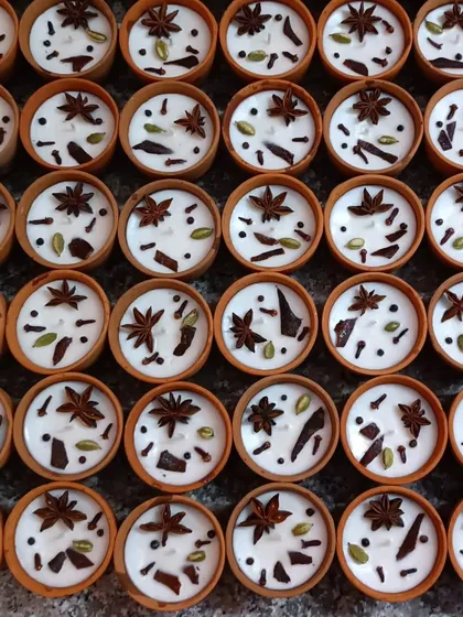 A top-down view of a large order of my premium scented spice candles. I can produce these in quantity for events or retail, ensuring each candle has the same high-quality finish and potent aroma.