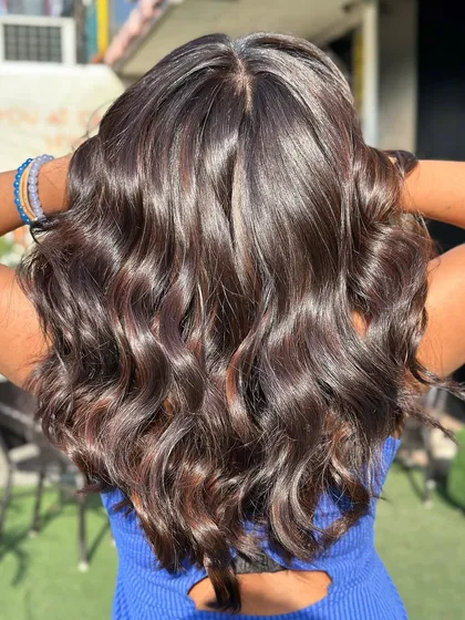 A stunning after shot of a global color without bleach. The hair is incredibly shiny, healthy, and has a rich, deep color.