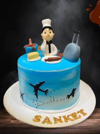 A special cake for a chef who loves to travel. This design combines both passions, with a fondant chef topper, cooking utensils, and airplanes flying around the side of the cake.