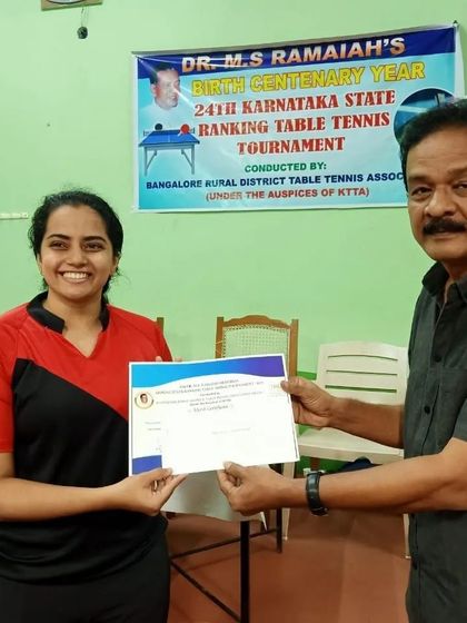 Kushi V receiving her certificate for a semifinalist finish in the Women's category at the MSR State Ranking Tournament.